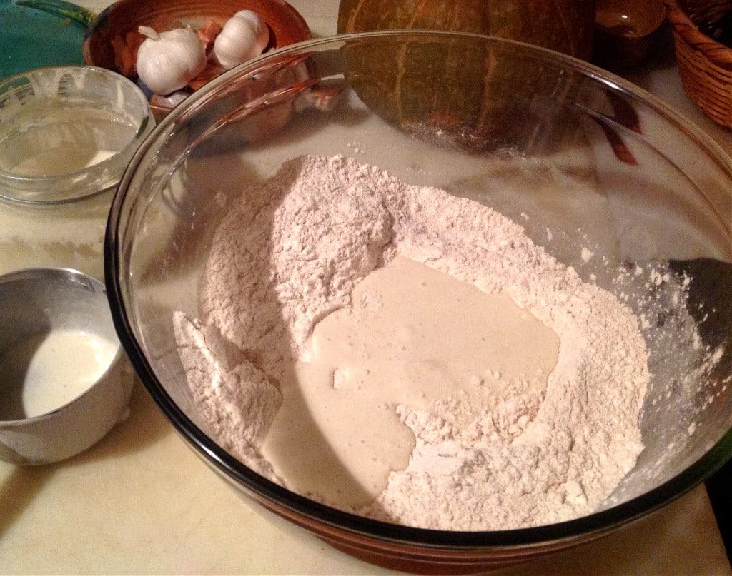 You won't believe how easy it is to make your own homemade sourdough bread with this no knead recipe! Using a homemade sourdough starter, and a few simple tools, this easy, sourdough bread is baked int a dutch oven with a foolproof recipe that comes out perfect every time. Transform your bread baking with this no knead sourdough bread recipe! #sourdough #sourdoughbread #noknead #bread #baking #realfood #traditionalfood no knead sourdough bread add sourdough starter