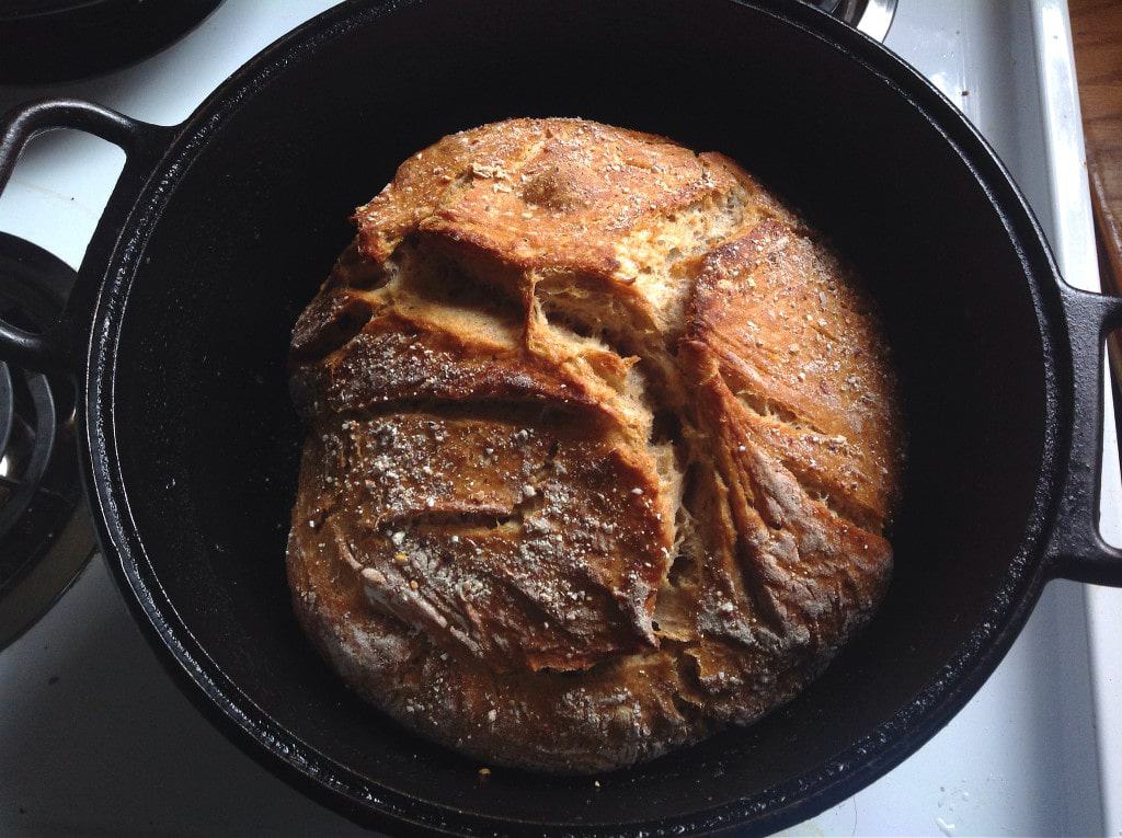 You won't believe how easy it is to make your own homemade sourdough bread with this no knead recipe! Using a homemade sourdough starter, and a few simple tools, this easy, sourdough bread is baked int a dutch oven with a foolproof recipe that comes out perfect every time. Transform your bread baking with this no knead sourdough bread recipe! #sourdough #sourdoughbread #noknead #bread #baking #realfood #traditionalfood How to Make No Knead Sourdough Bread in a Dutch Oven