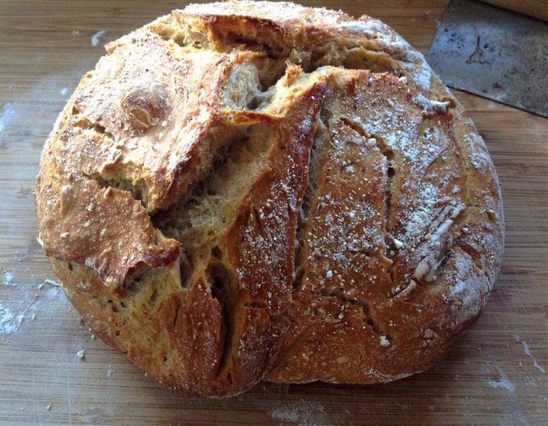 You won't believe how easy it is to make your own homemade sourdough bread with this no knead recipe! Using a homemade sourdough starter, and a few simple tools, this easy, sourdough bread is baked int a dutch oven with a foolproof recipe that comes out perfect every time. Transform your bread baking with this no knead sourdough bread recipe! #sourdough #sourdoughbread #noknead #bread #baking #realfood #traditionalfood no knead sourdough bread