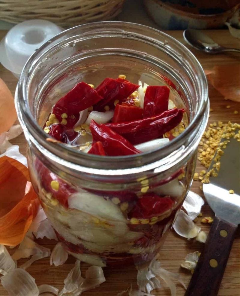 peppers in a jar with brine to make fermented hot sauce