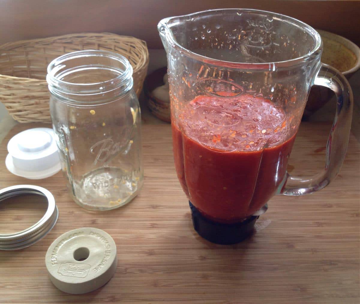 fermented hot sauce in a blender on a table