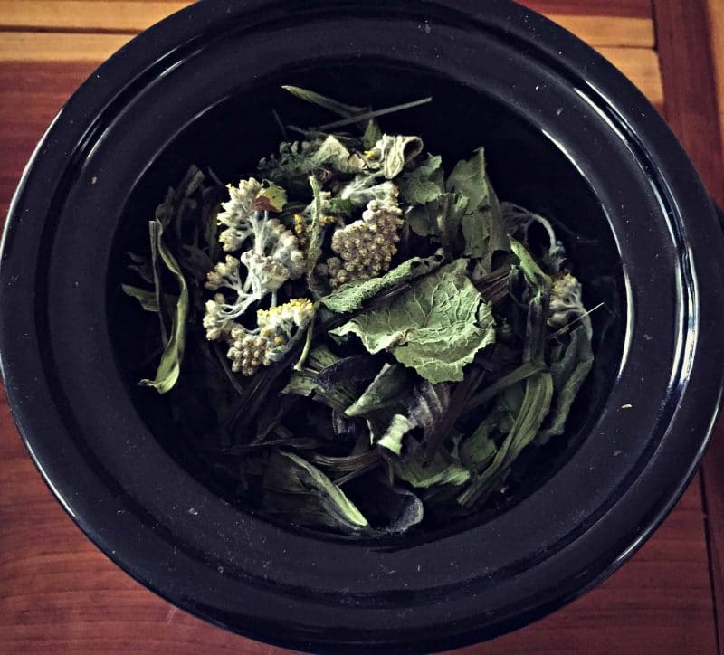 dried herbs in a mini slow cooker