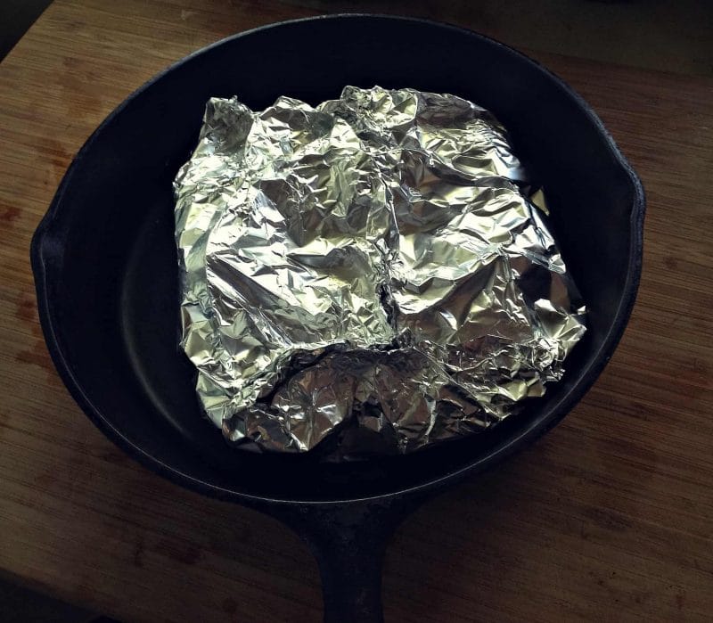 beets wrapped in foil in a cast iron skillet