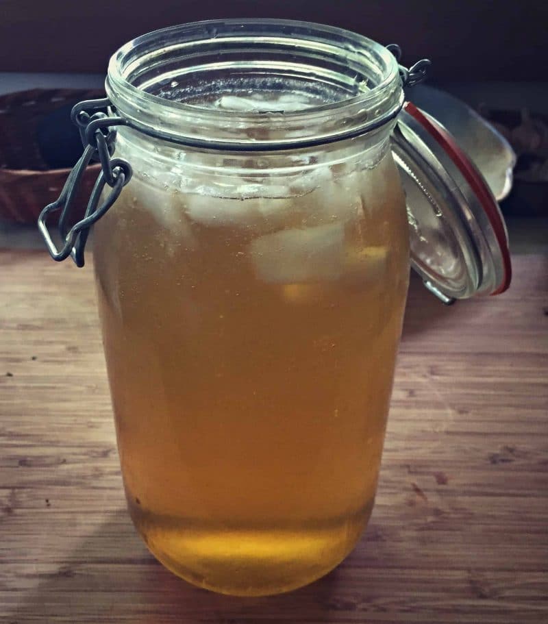 Lemon bam is an edible and medicinal herb in the mint family. You may not have heard of it, but you've probably seen it and may even have some growing in your own backyard. Learn how to identify lemon balm, how to forge for it, how to grow it, and its many culinary and herbal medicine uses. Plus a recipe for lemon balm iced tea! #herbalism #herbs #gardening #foraging lemon balm green tea
