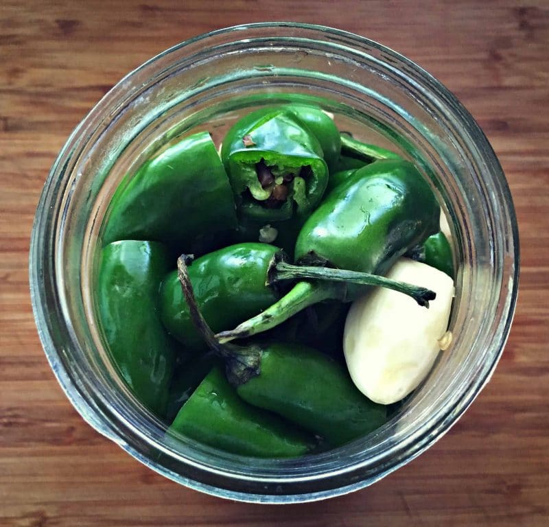 chilis and garlic in a jar