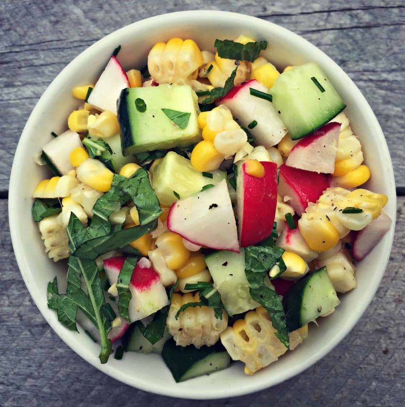 a bowl of corn and radish salad