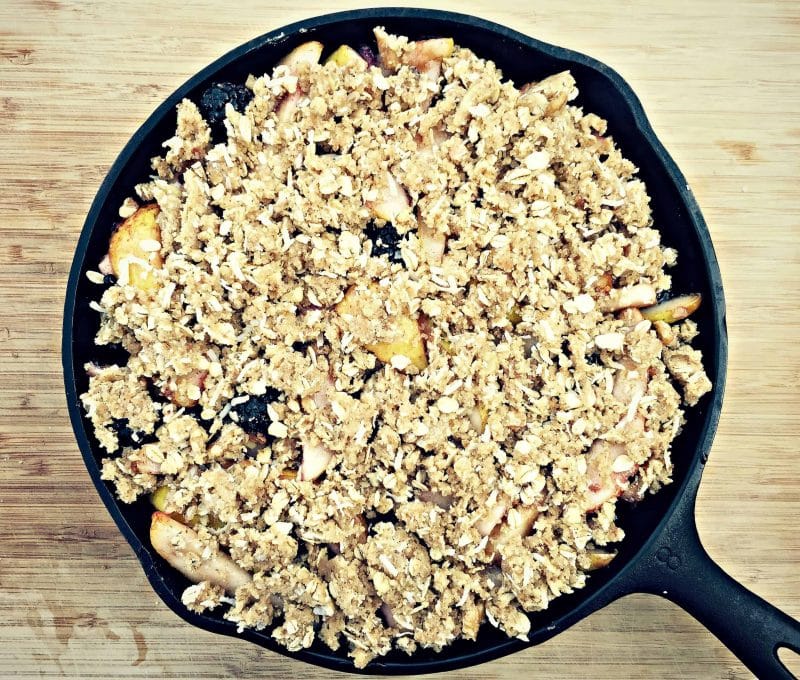 skillet with unbaked Pear and Blackberry Crisp