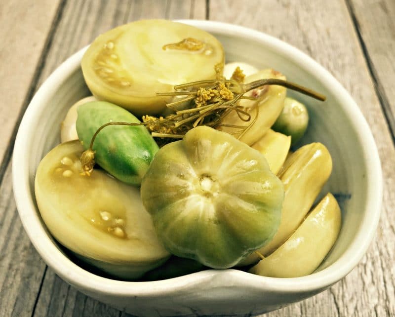 fermented green tomatoes in a bowl