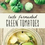 Fresh green tomatoes on a cutting board and a jar of lacto fermented green tomatoes.