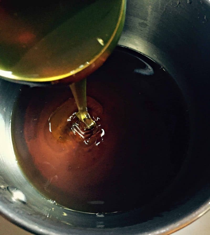honey pouring into pan