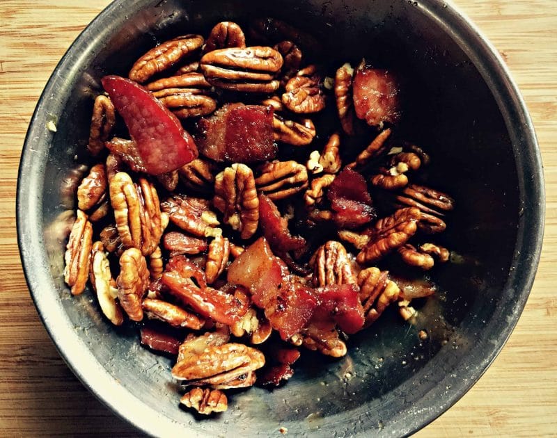 a metal bowl of maple pecans and bacon