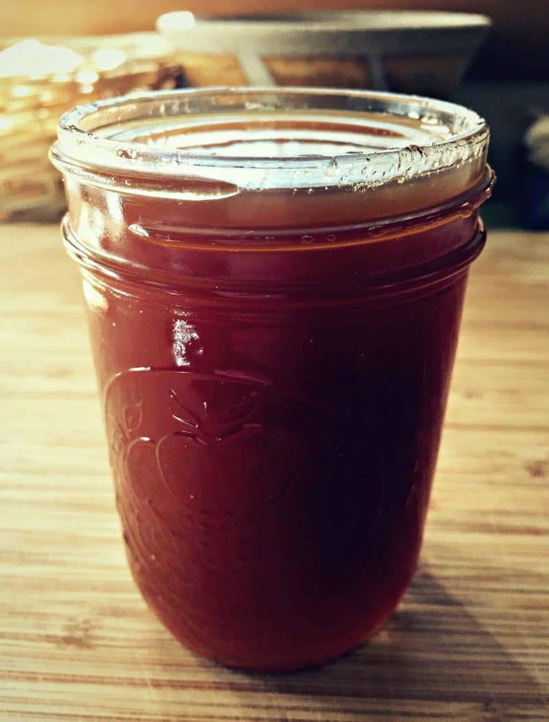 rose hip syrup in a mason jar