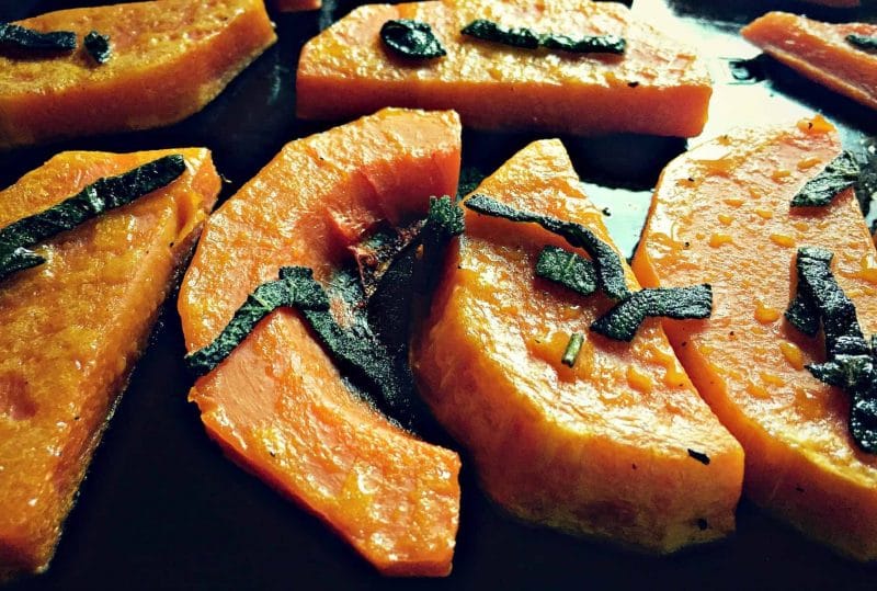 Roasted butternet squash pieces with sage.