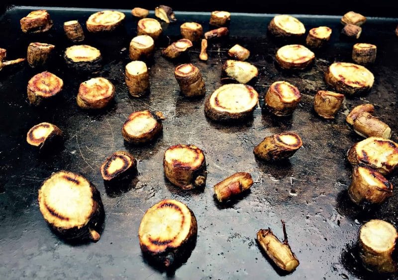 roasted burdock root on a sheet pan