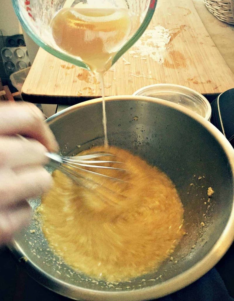 whisking the grapefruit juice into the butter and sugar mixture