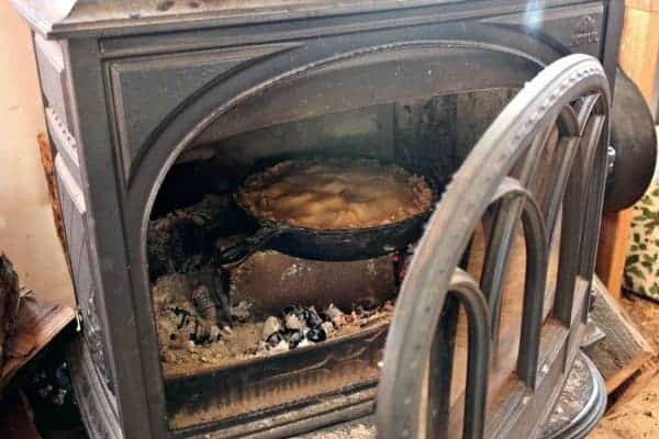 a pie baking in a woodstove