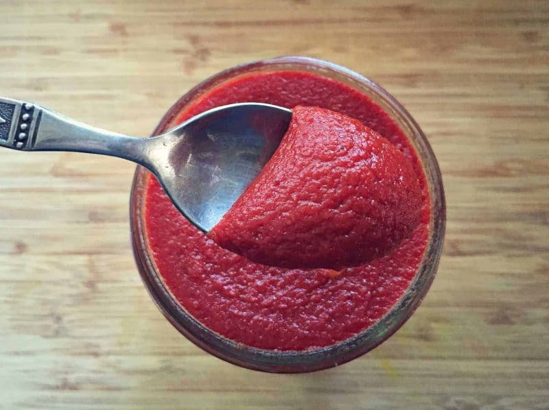 a spoon with fermented ketchup