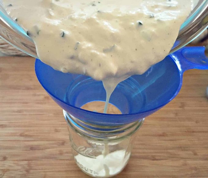 pour blue cheese into jar