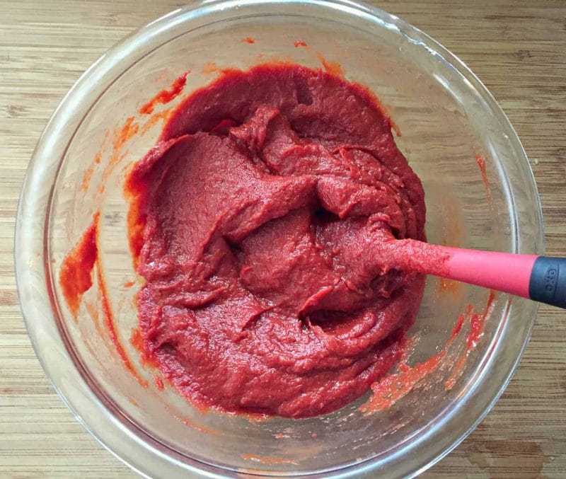 stirring ketchup ingredients together in bowl 
