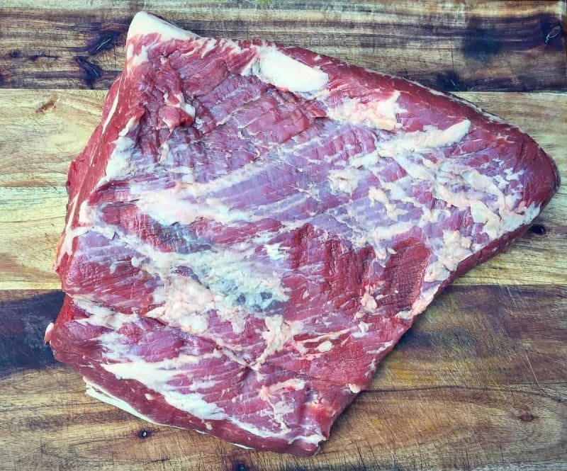 brisket on a wooden cutting board