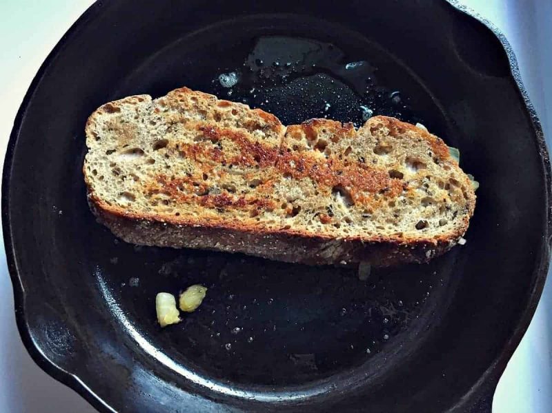 flip reuben sandwich in cast iron skillet