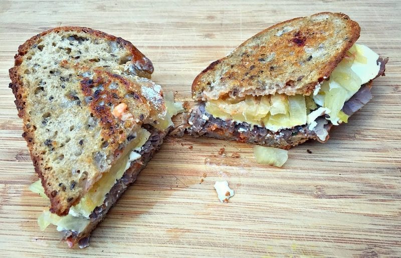 homemade reuben sandwich on a cutting board