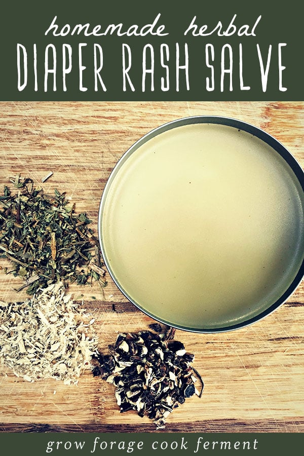 Learn how to make this homemade herbal diaper rash salve that works! Skip the chemicals and additives and make this easy diaper rash ointment using infused oil, beeswax, and natural herbs. You'll feel great about using this all natural diaper rash treatment for baby. A tin of herbal diaper rash salve with dried herbs.