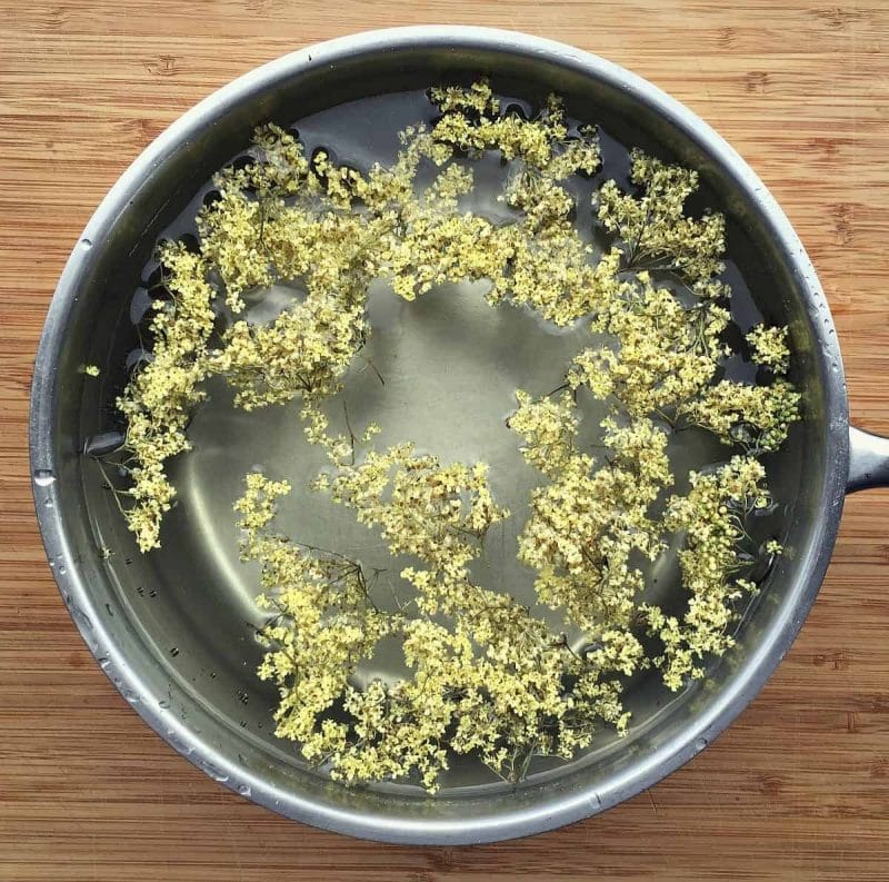 elderflowers in a pot of water to make tea