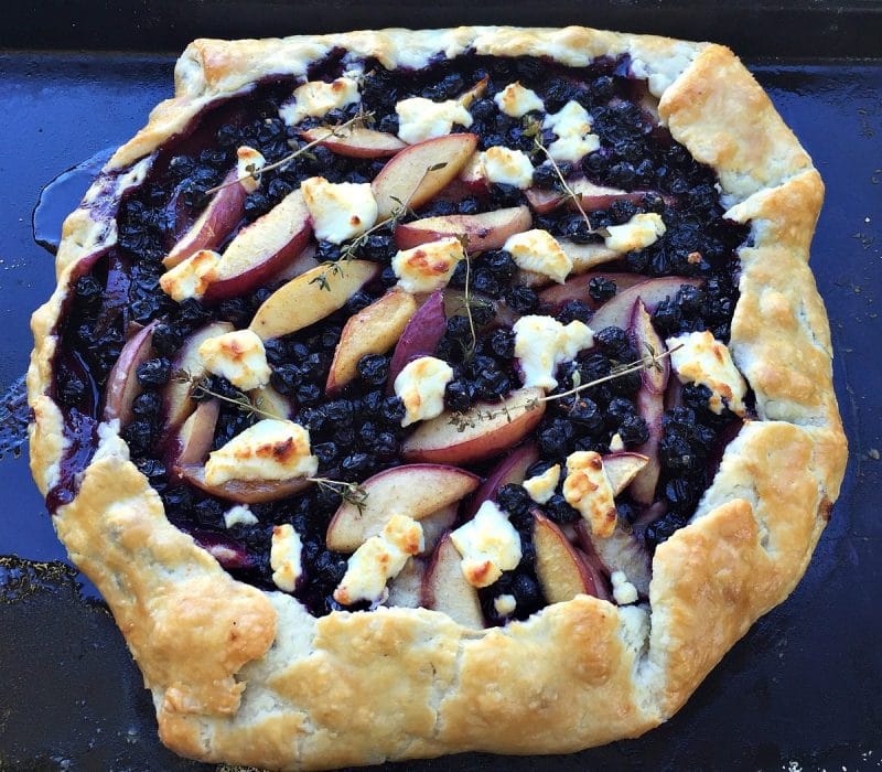 baked peach and blueberry galette with goat cheese and thyme