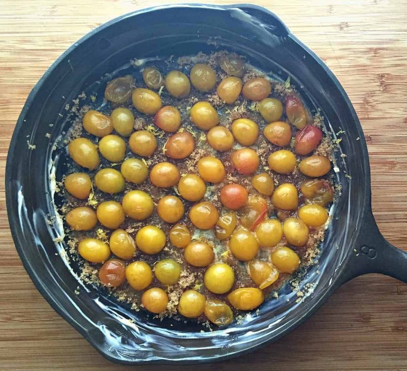 plums in a cast iron skillet