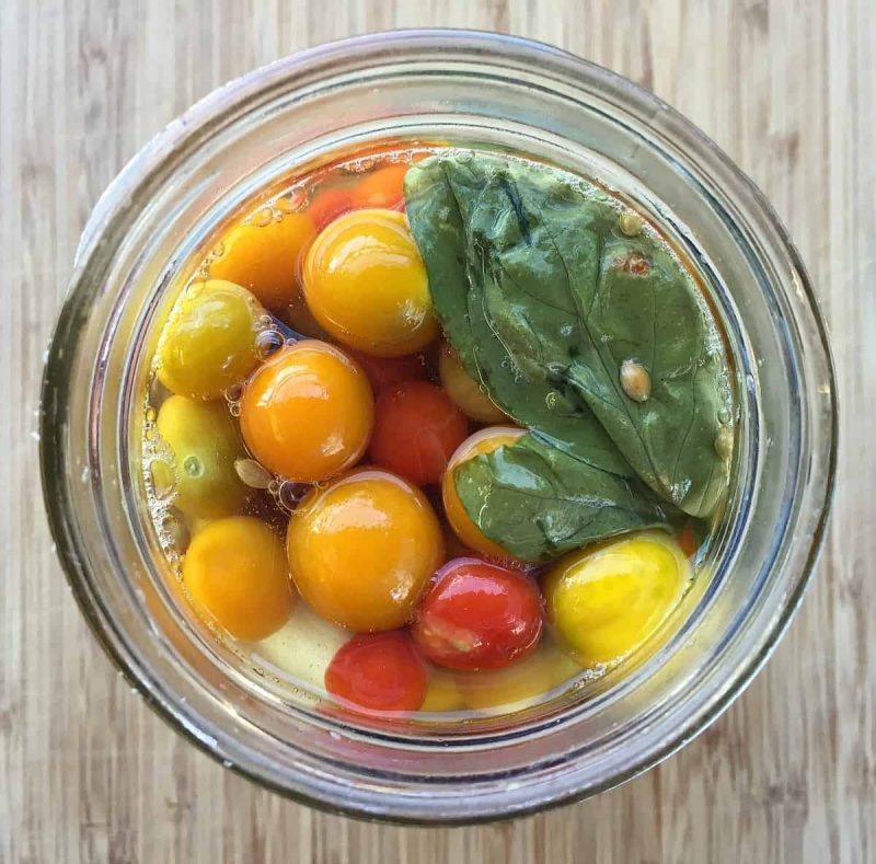 fermented cherry tomatoes in a jar top view