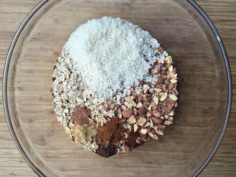 bowl with dry ingredients for pumpkin coconut almond granola