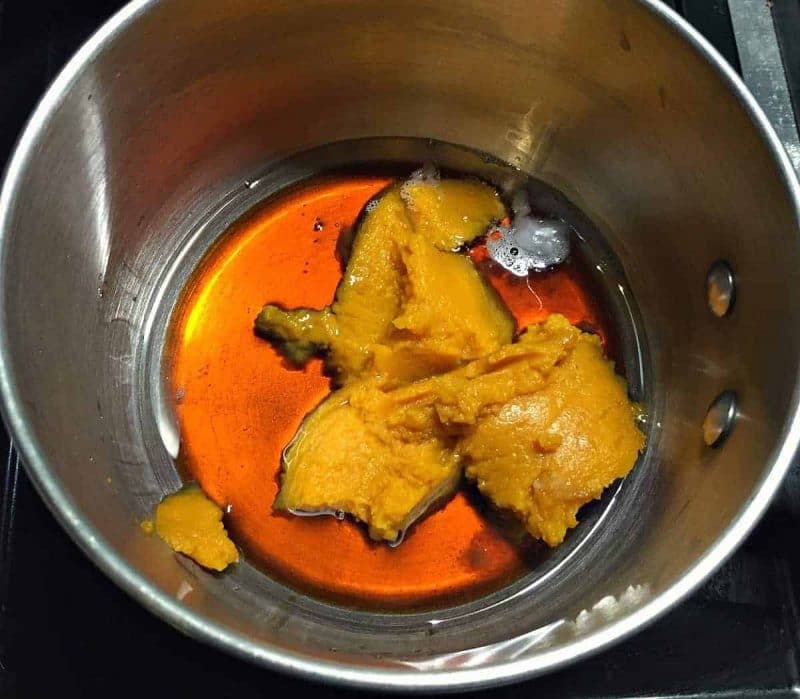 saucepan with wet ingredients for pumpkin coconut almond granola