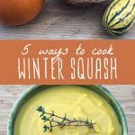 A variety of winter squash on a wood table, and a bowl of winter squash soup.