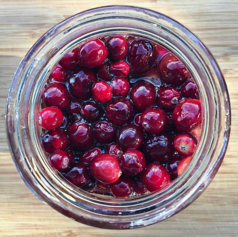 fermented honey cranberries in a jar