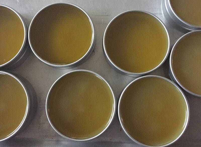 tins of freshly made beard balm that is setting up