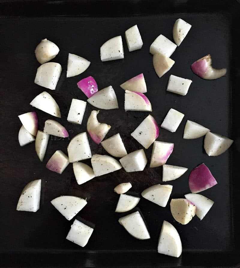 cubed turnip roots on a sheet pan