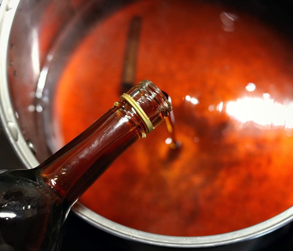 adding pure maple syrup to the pot