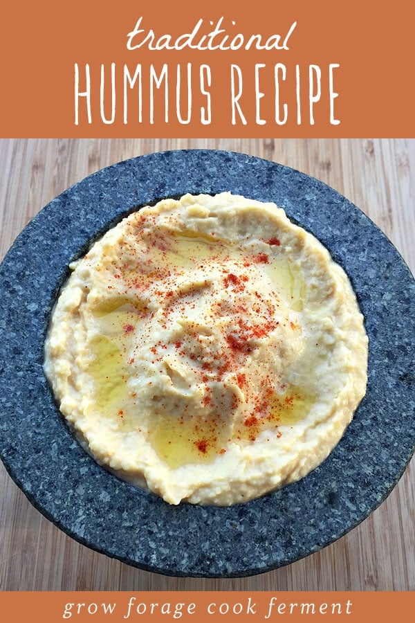 A bow of traditionally prepared hummus with olive oil and paprika.