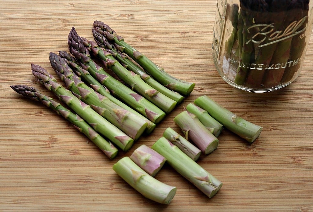 cutting the woody ends off of asparagus