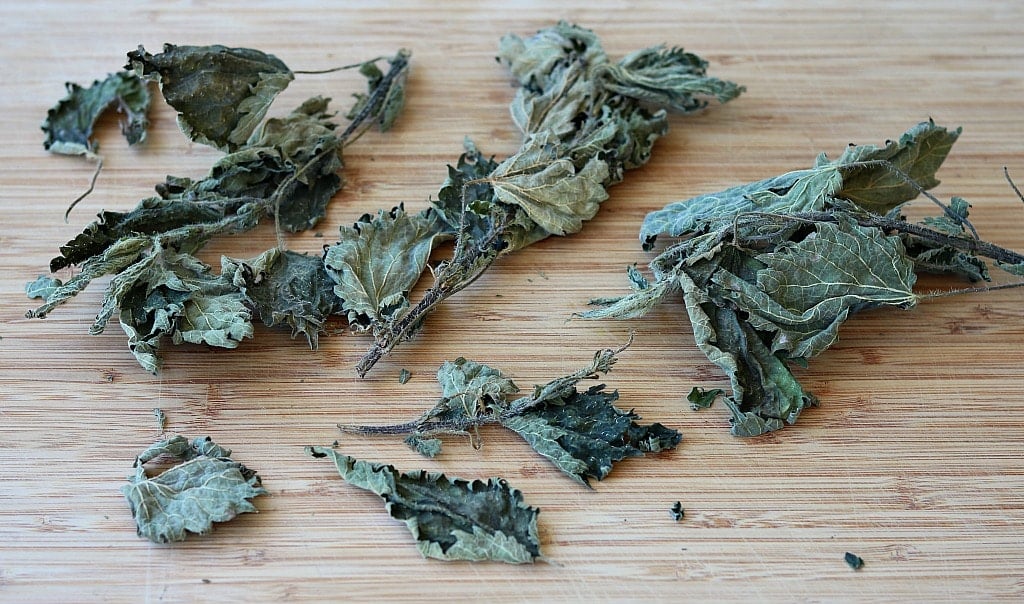 dried nettle leaves on a table