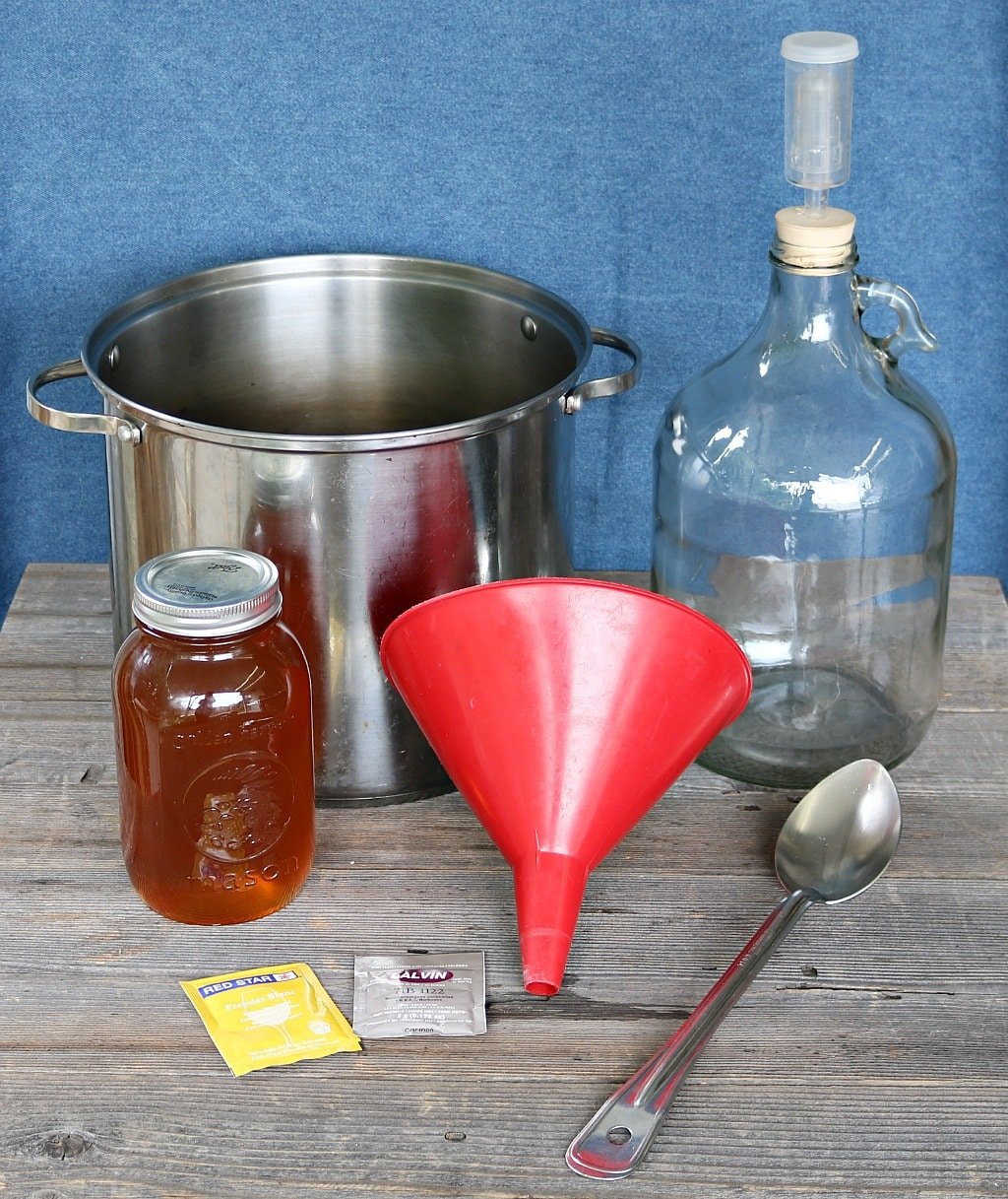 mead equipment, honey, and yeast on a table