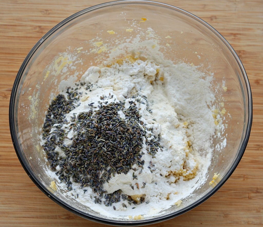a mixing bowl with lemon lavender cookie ingredients