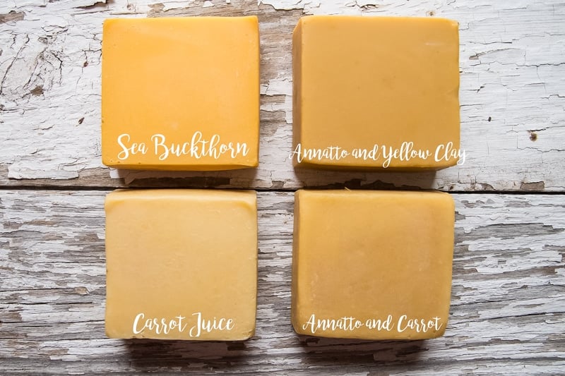 Four bars of dandelion soap showing the difference in natual yellow colorants