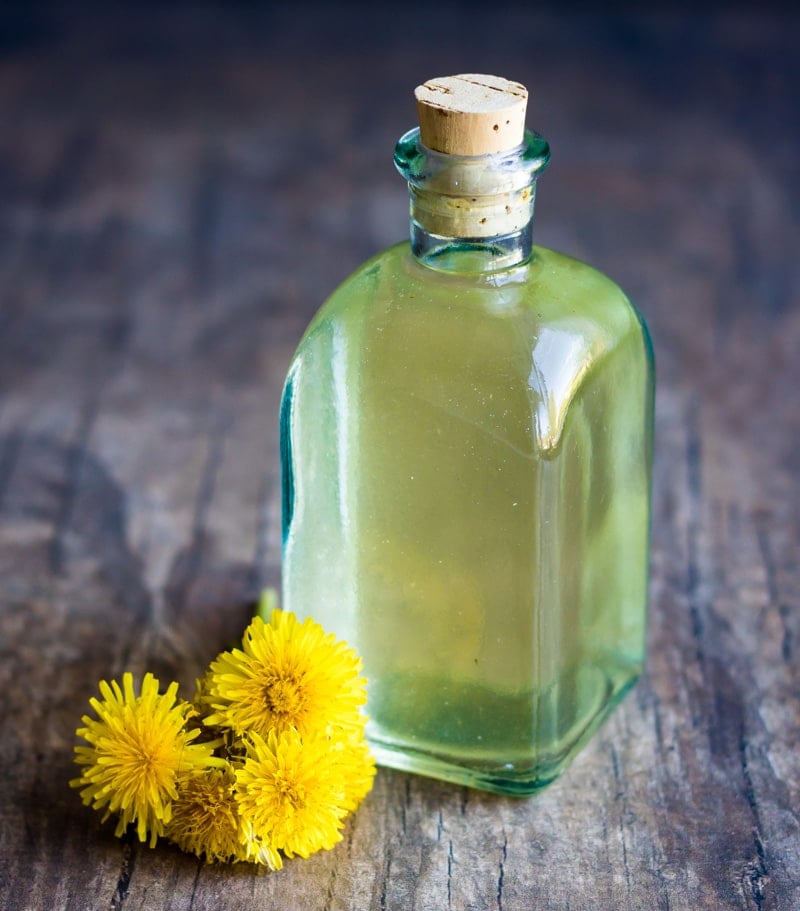 the finished strained dandelion vinegar