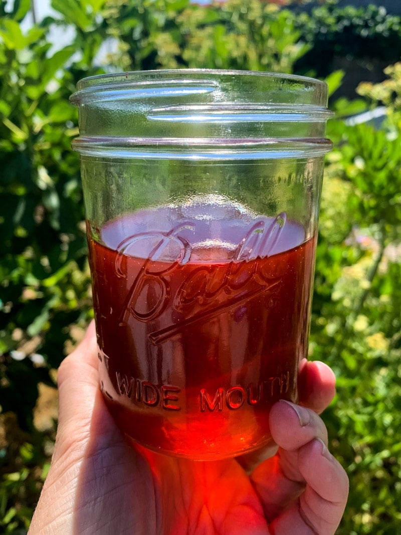 a jar of red st. john's wort infused oil