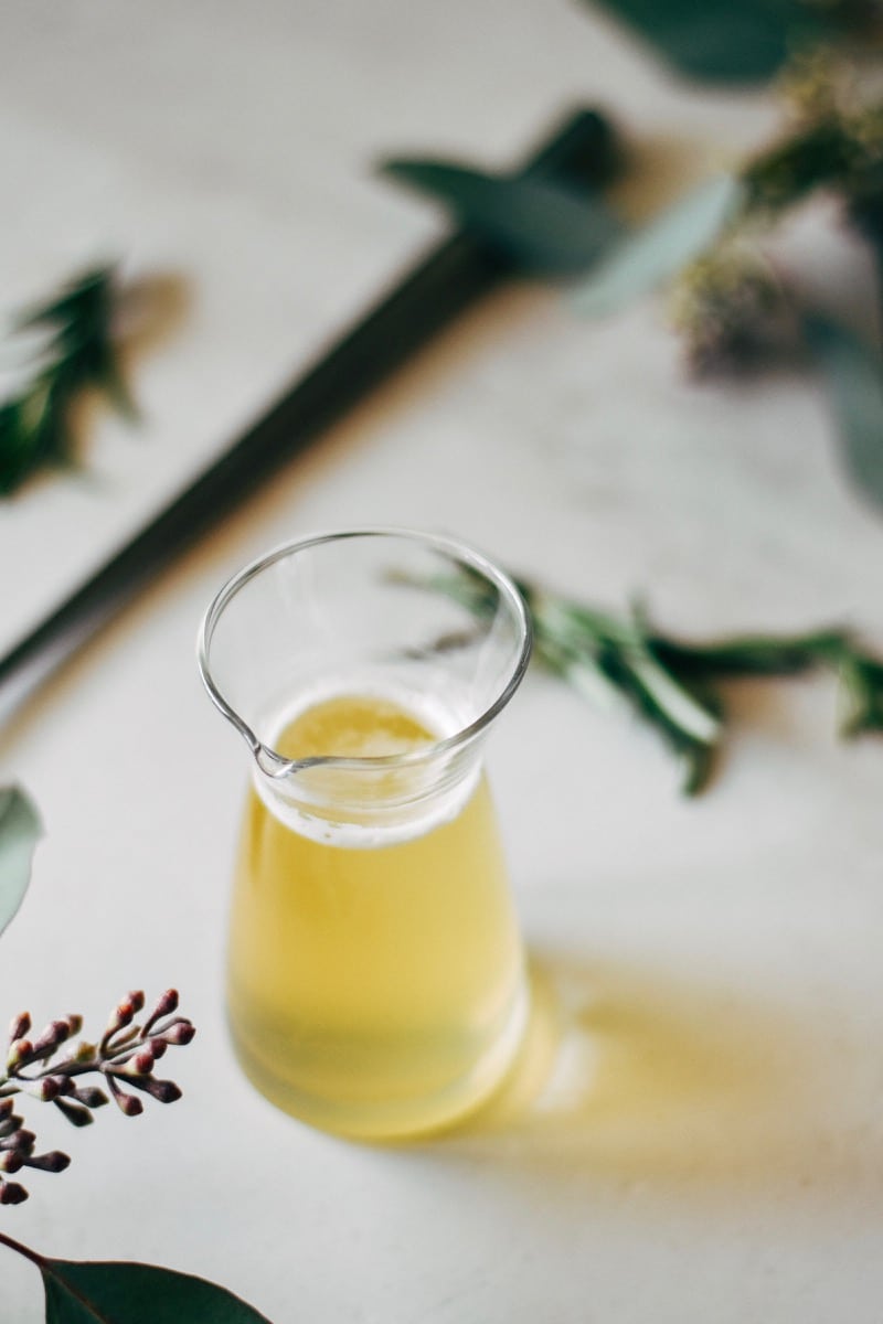 rosemary honey syrup in a glass carafe