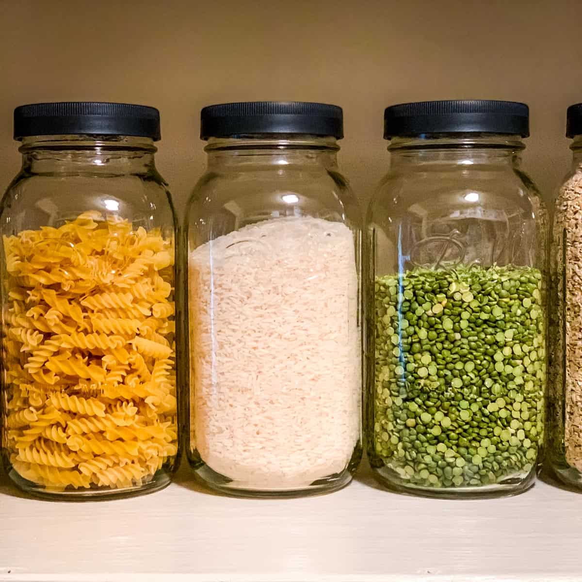 half gallon ball jars filled with pantry food items