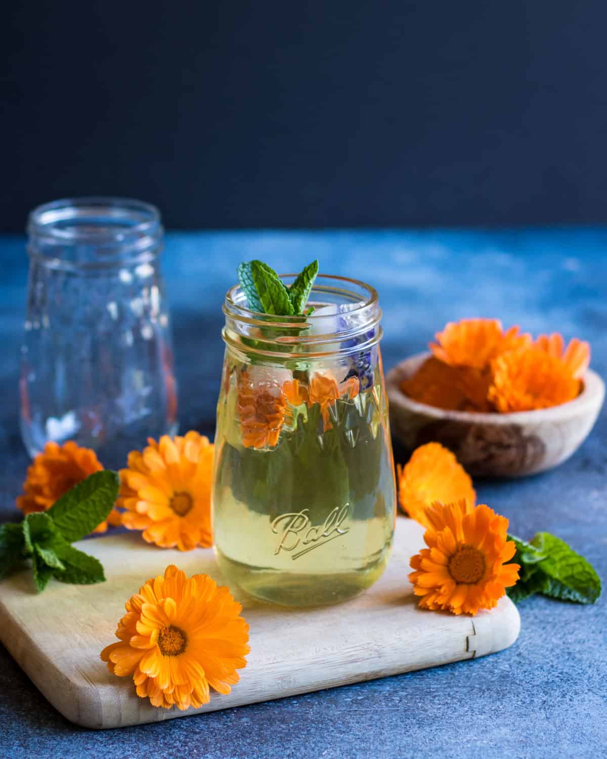 calendula iced tea served in a ball flute jar