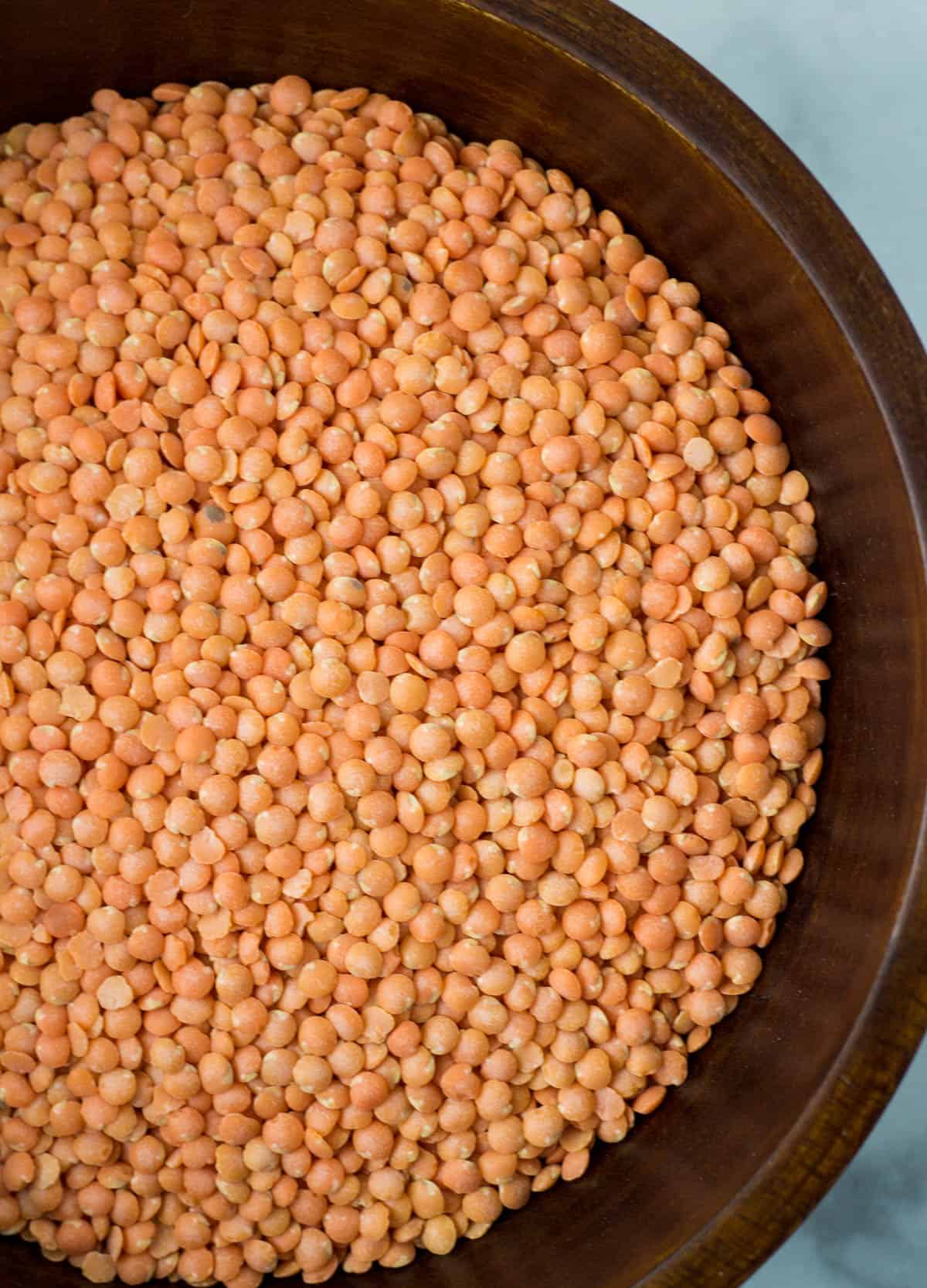 a bowl of dried red lentils